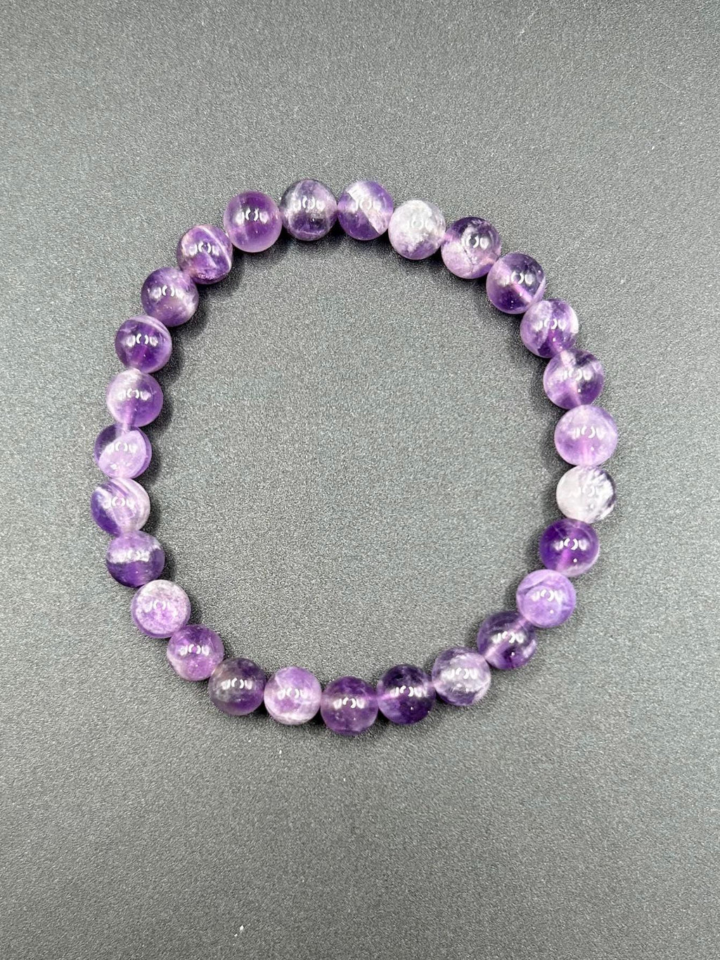 Amethyst, calms the mind, boost intuition and protects your energy (1 per order)